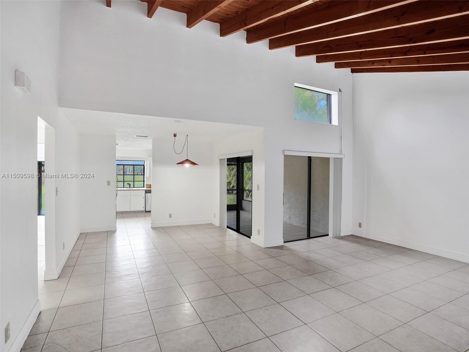 19621 Back 9 Drive Boca Raton, FL 33498 - Photo 3 of 45 a view of a big room with closet and windows