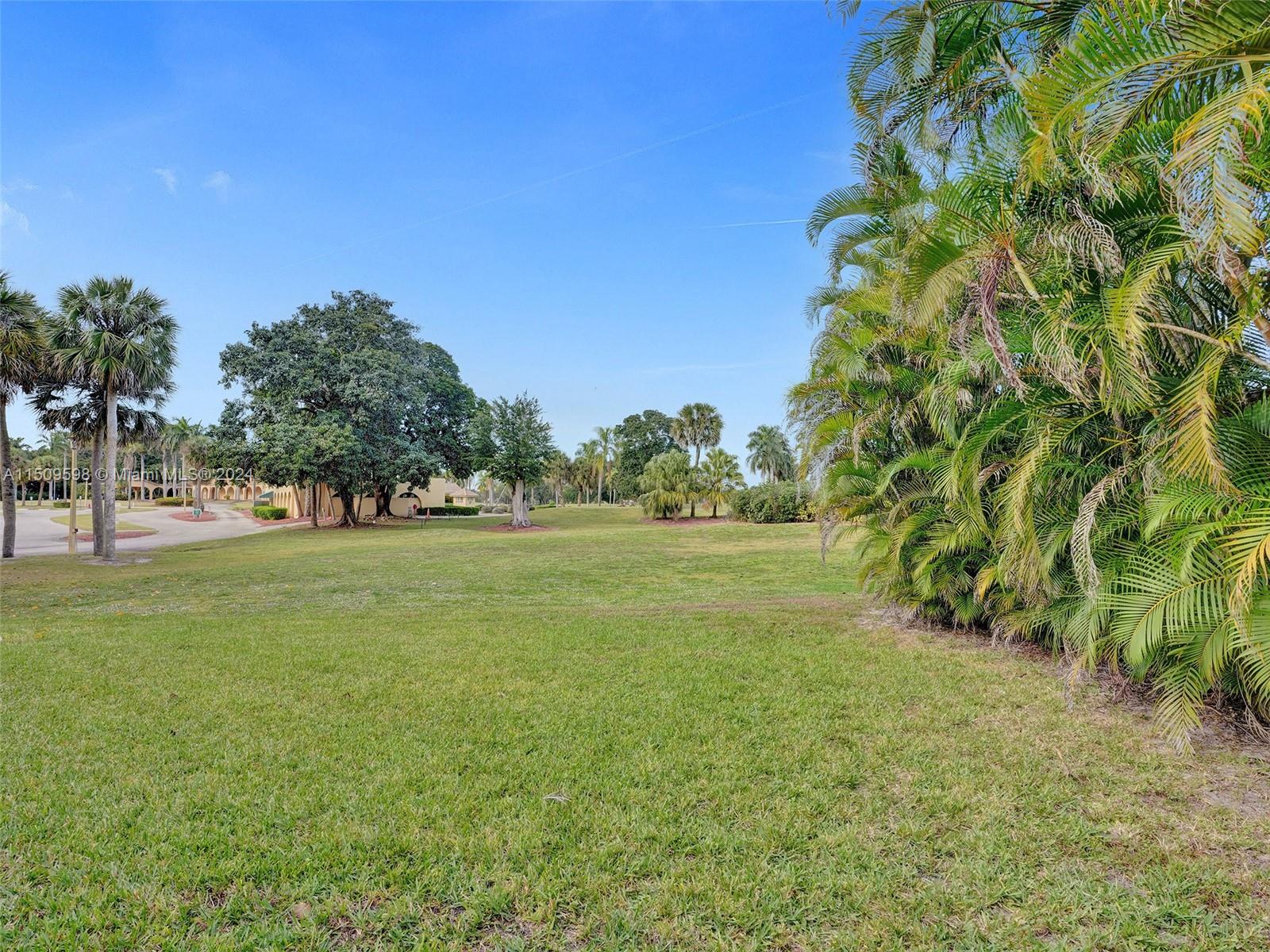 19621 Back 9 Drive Boca Raton, FL 33498 - Photo 33 of 45 a view of outdoor space with garden and trees