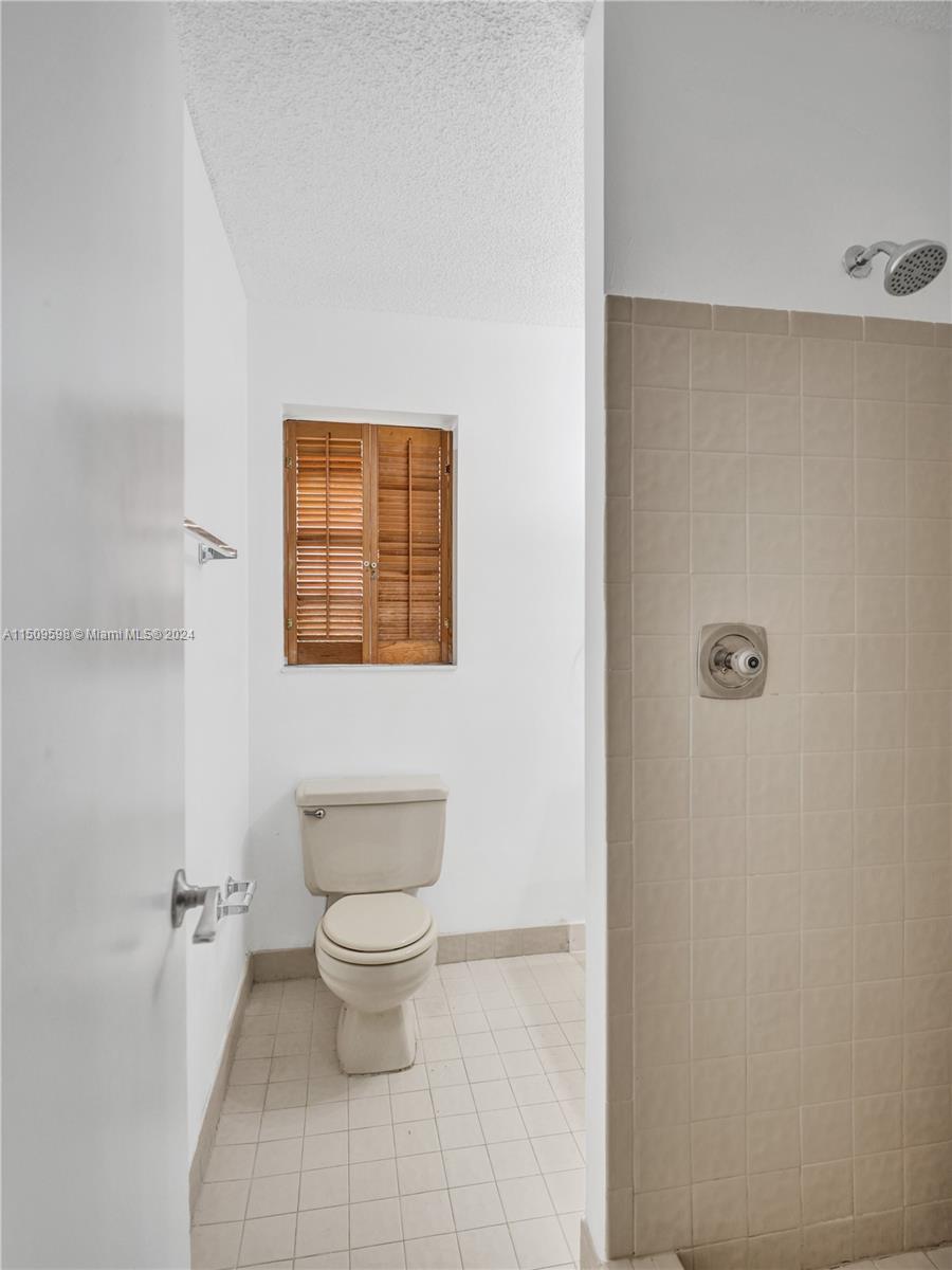 19621 Back 9 Drive Boca Raton, FL 33498 - Photo 40 of 45 a bathroom with a toilet and a sink