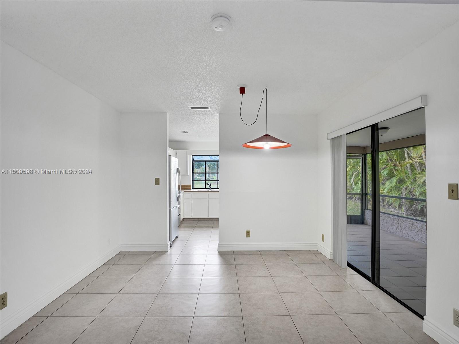 19621 Back 9 Drive Boca Raton, FL 33498 - Photo 9 of 45 a view of a livingroom with an empty space and a window