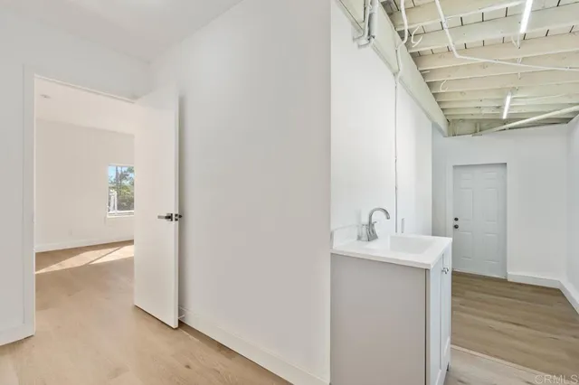 a view of cabinets and wooden floor