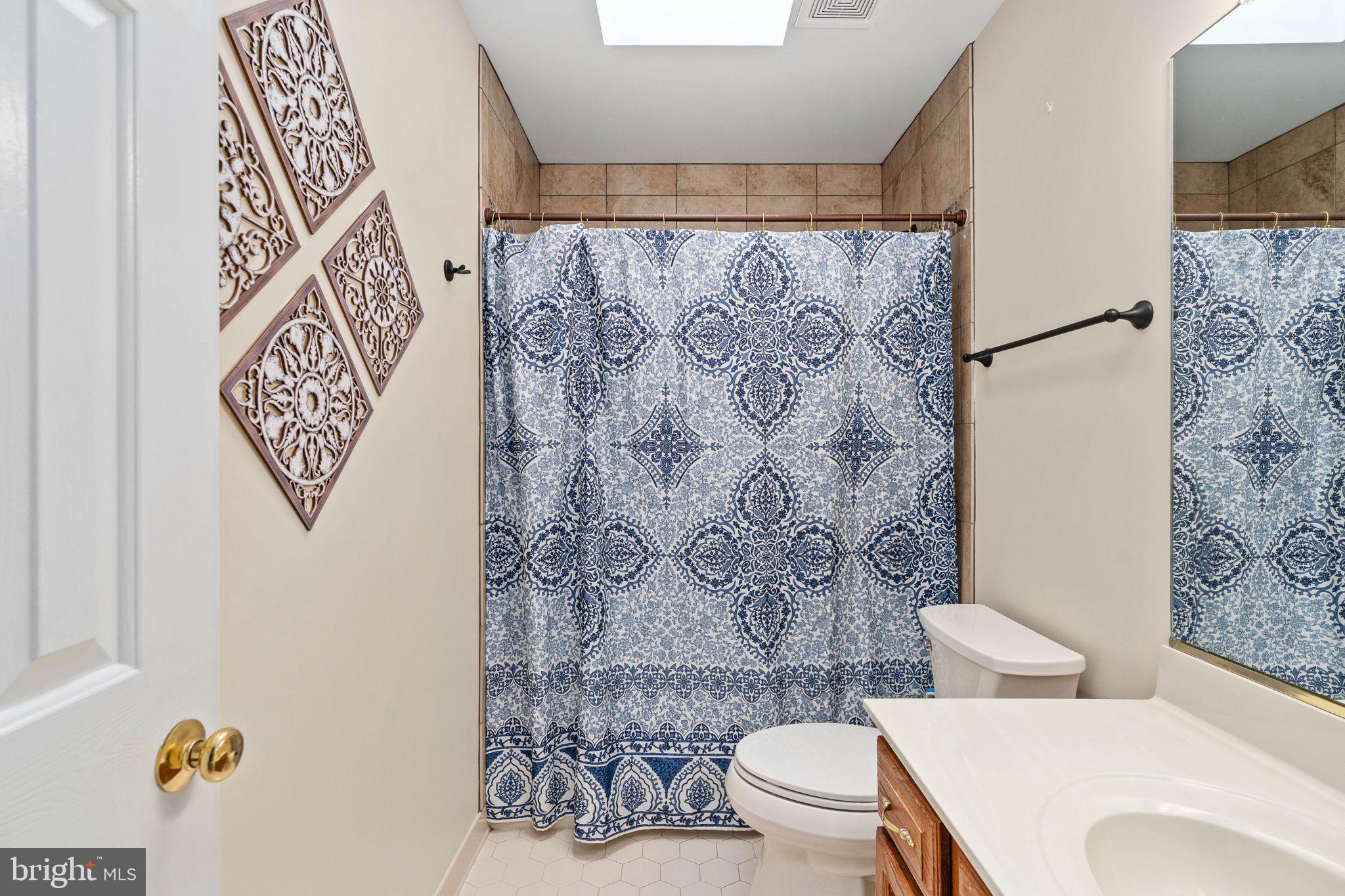 100 Boscobel Road Fredericksburg, VA 22405 - Photo 44 of 95 Upstairs Hall Bathroom with tiled shower and bath.