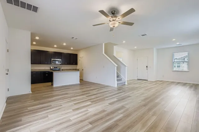 a view of kitchen with cabinets and wooden floor