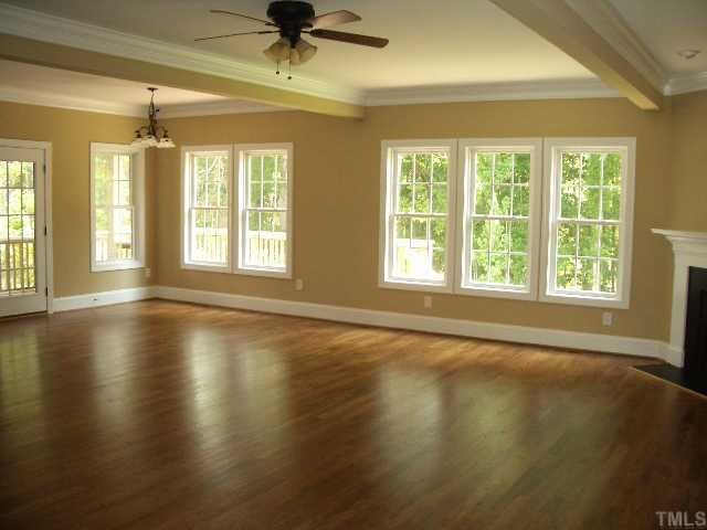 3505 Griffice Mill Road Raleigh, NC 27610 - Photo 5 of 12 a view of an empty room with a window and wooden floor
