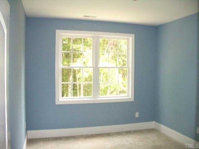 3505 Griffice Mill Road Raleigh, NC 27610 - Photo 9 of 12 a view of an empty room with a window