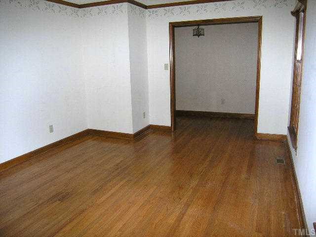 1108 Imperial Road Cary, NC 27511 - Photo 3 of 5 a view of a small space with wooden floor and a sink