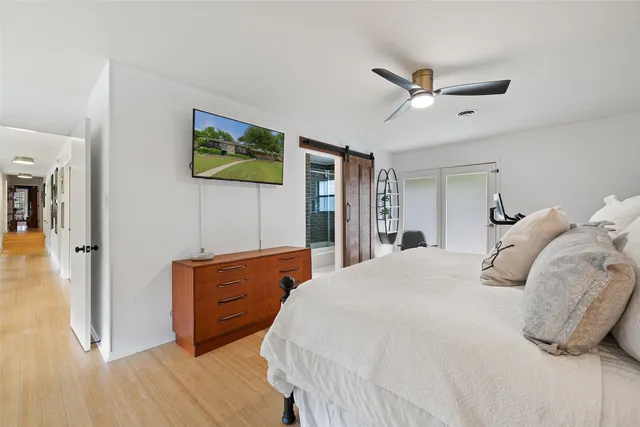 a bedroom with a bed and a dresser