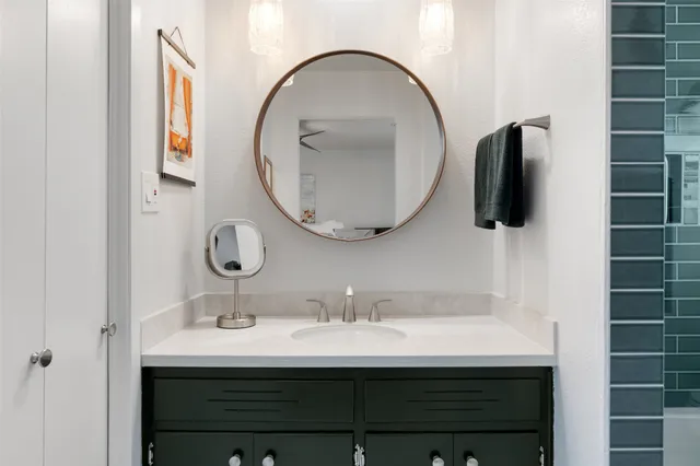 a bathroom with a sink and a mirror