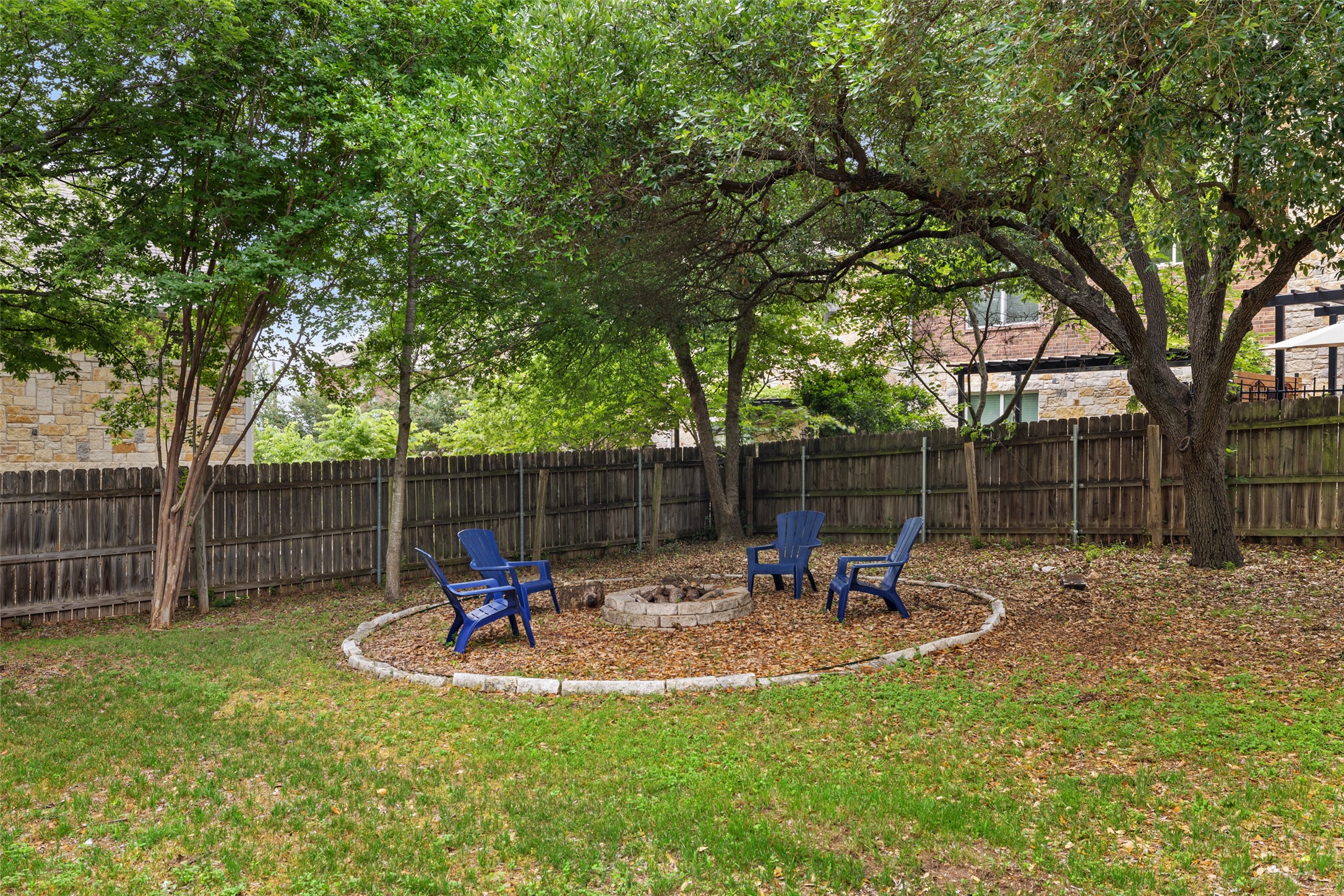 1712 McCoy Place Georgetown, TX 78626 - Photo 32 of 34 a backyard of a house with table and chairs