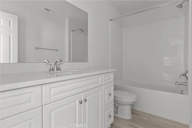 a bathroom with a sink a toilet and a bathtub