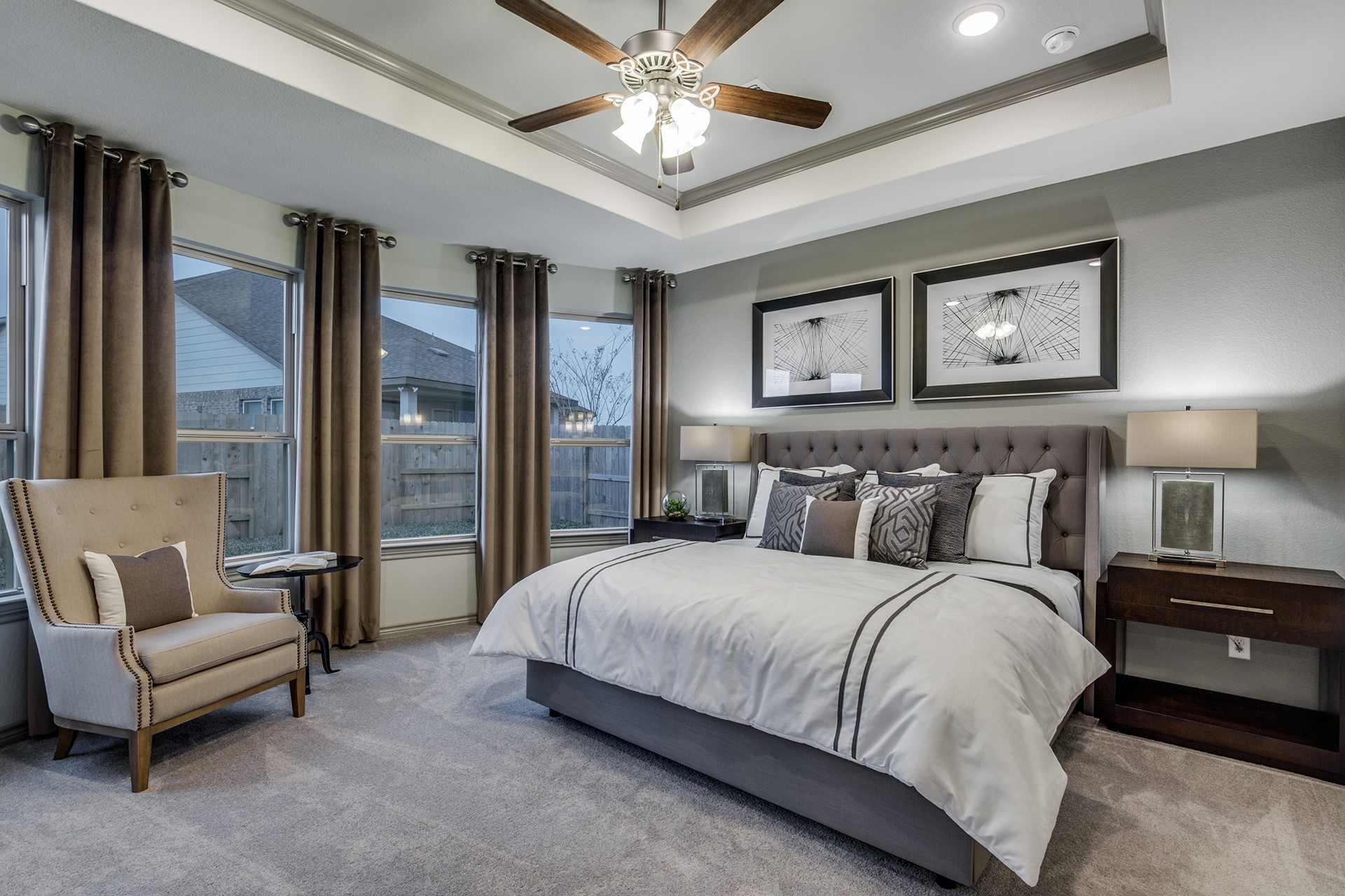15638 Wandering Maple Way Conroe, TX 77302 - Photo 7 of 20 a bedroom with a large bed couch and two windows