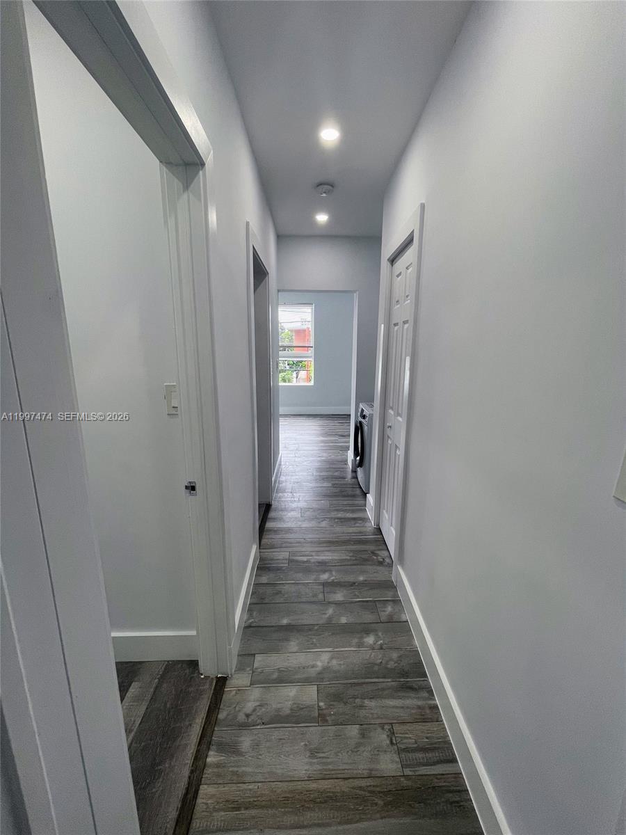 1036 Southwest 5th Street, Unit 8 Miami, FL 33130 - Photo 7 of 13 a view of a hallway with wooden floor and stairs