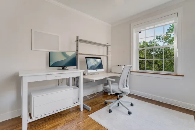 a work room with furniture and windows