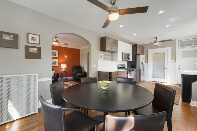 a view of a dining room with furniture and wooden floor