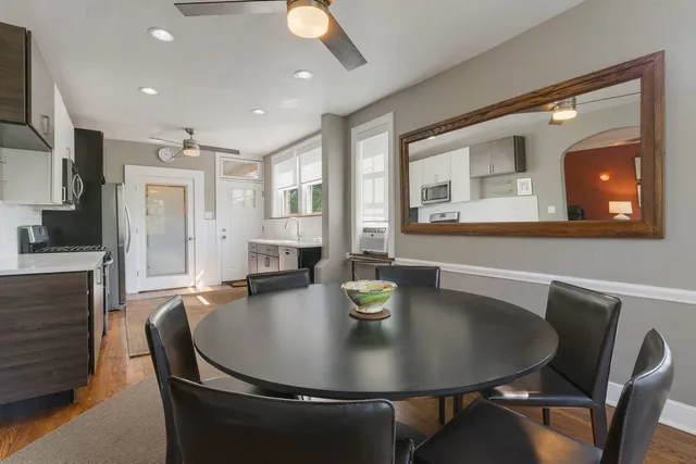 a dining room with furniture and window