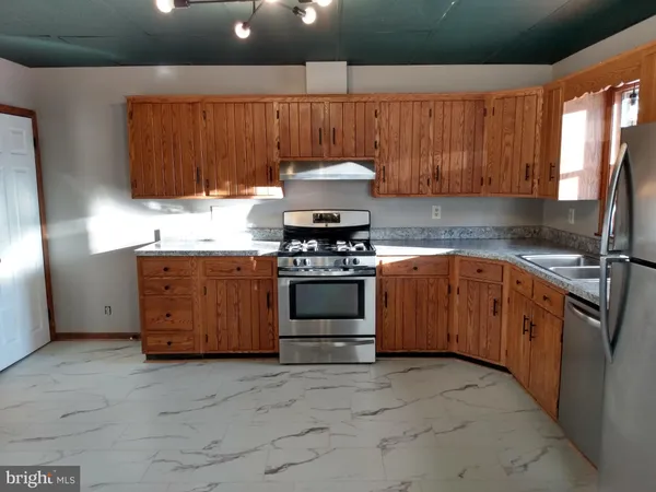 a kitchen with a stove and a sink