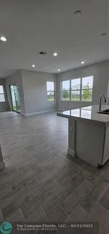 a view of a kitchen with furniture and windows