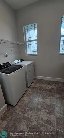 a room with wooden floor and window