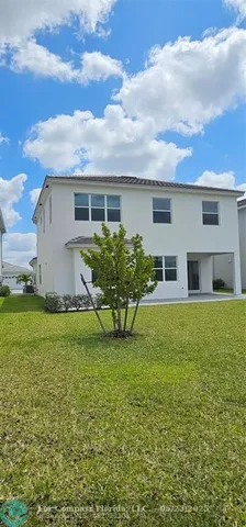 a house view with a backyard