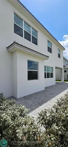 a view of a garden with an outdoor space