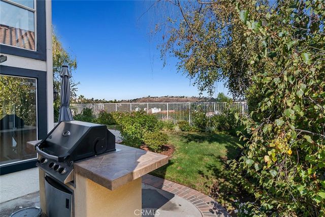 a view of a balcony filled with furniture and a potted plant