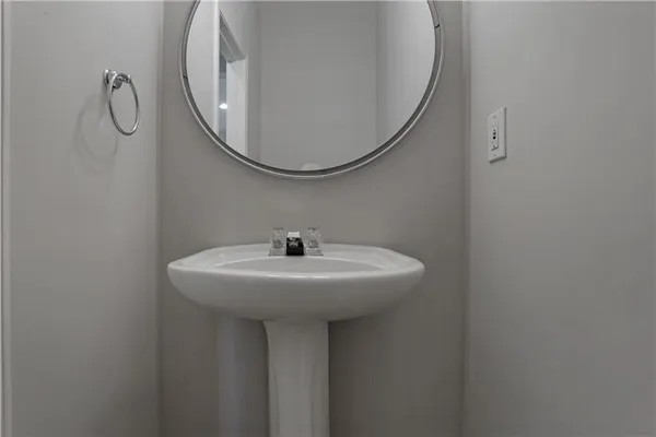 a bathroom with a sink a mirror and a shower