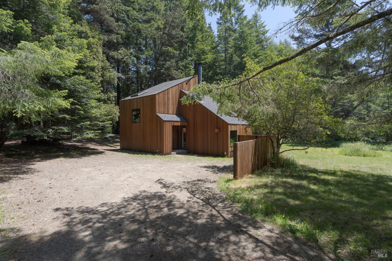 36778 Timber Ridge Road The Sea Ranch, CA 95497 - Photo 43 of 44 a backyard of a house with lots of green space