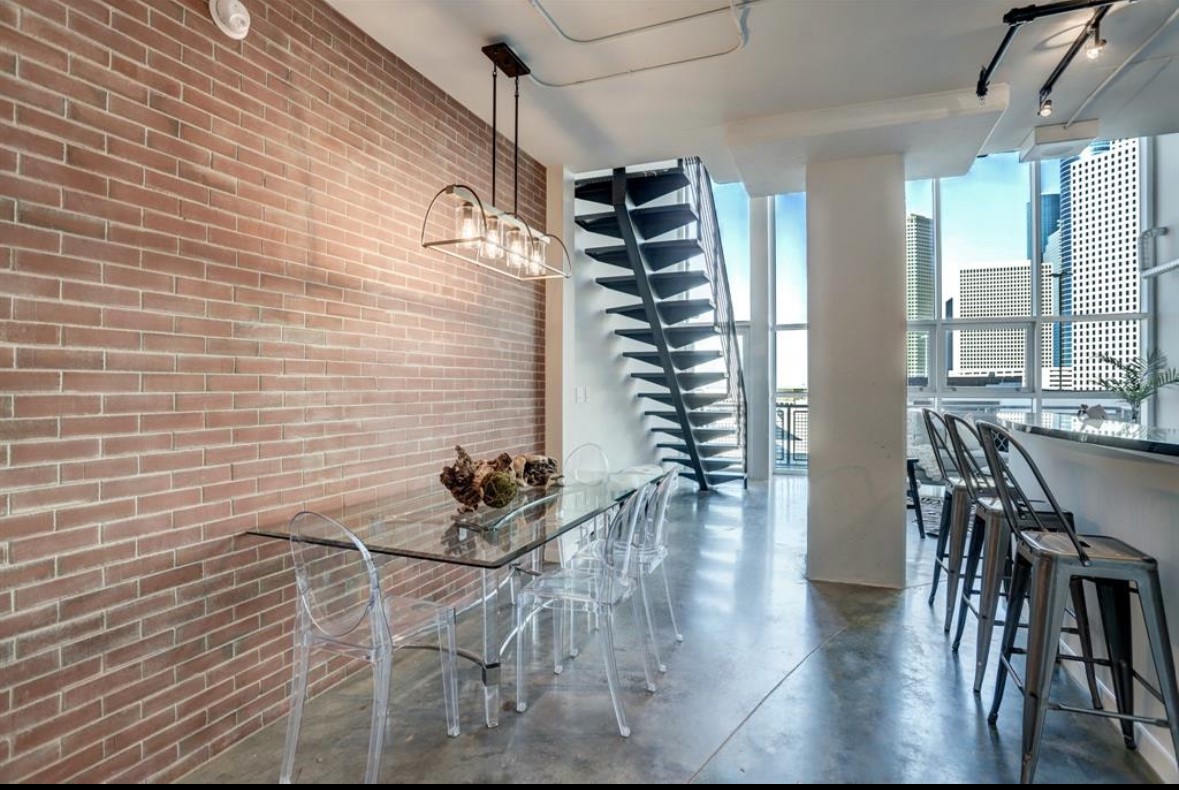 2000 Bagby Street, Unit 9420 Houston, TX 77002 - Photo 3 of 30 a dining room with furniture and wooden floor
