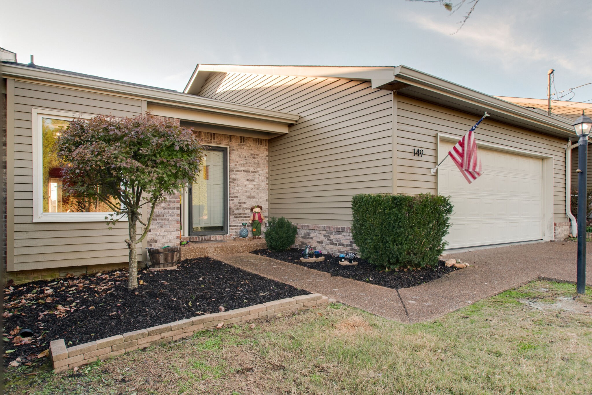 a front view of a house with garden