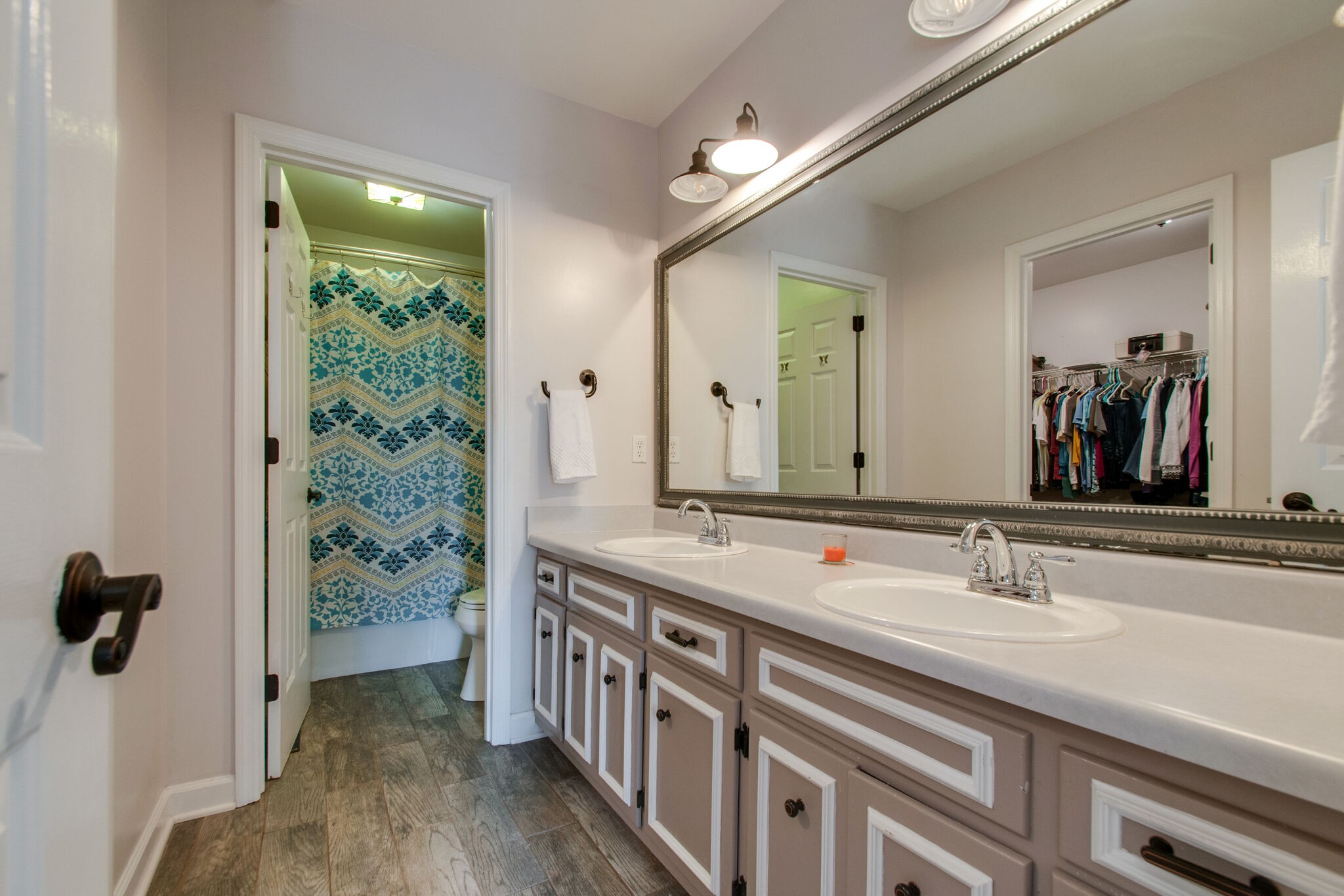 149 Morton Mill Circle Nashville, TN 37221 - Photo 20 of 27 a bathroom with a double vanity sink and a mirror
