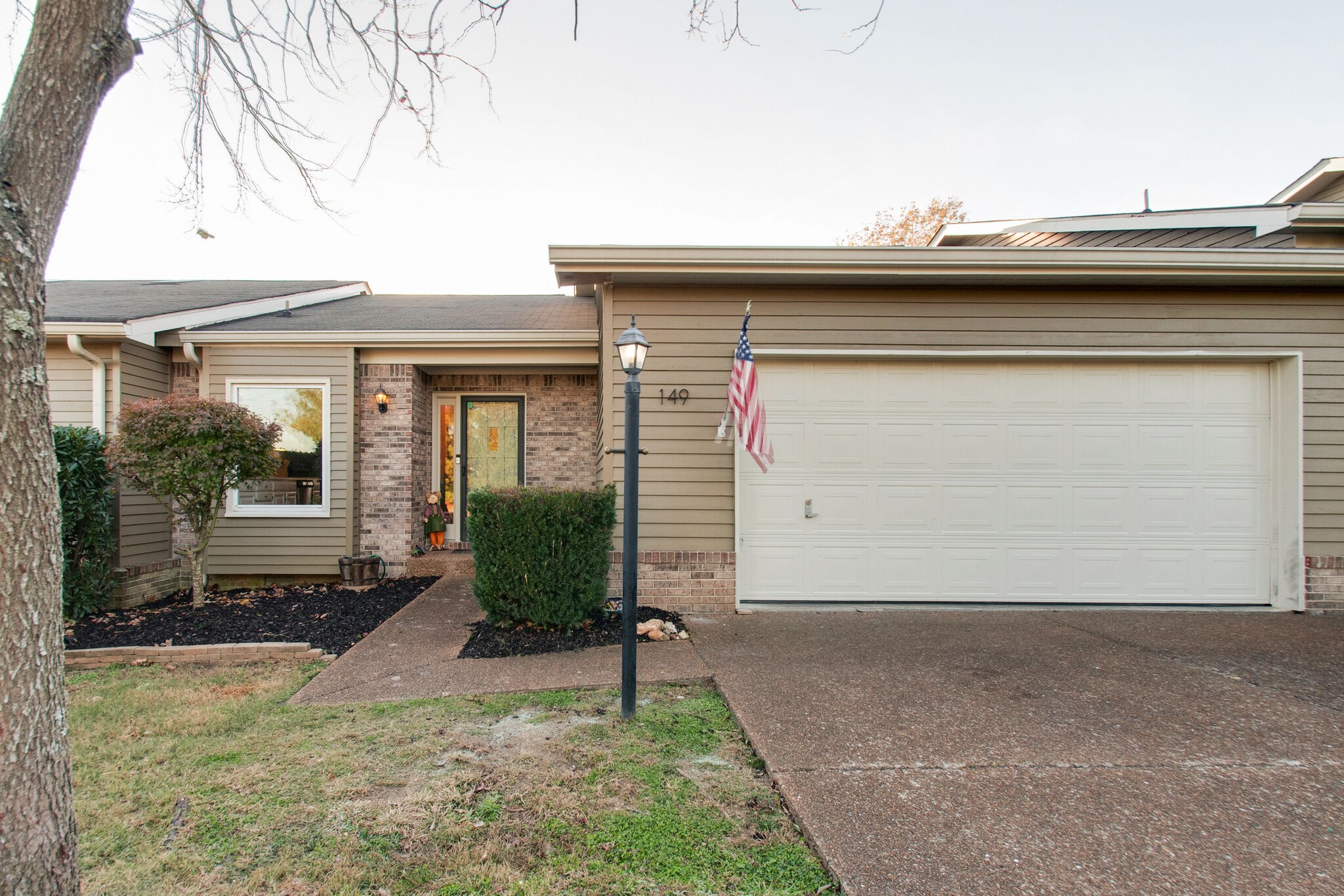 149 Morton Mill Circle Nashville, TN 37221 - Photo 3 of 27 a view of a house with a yard and plants