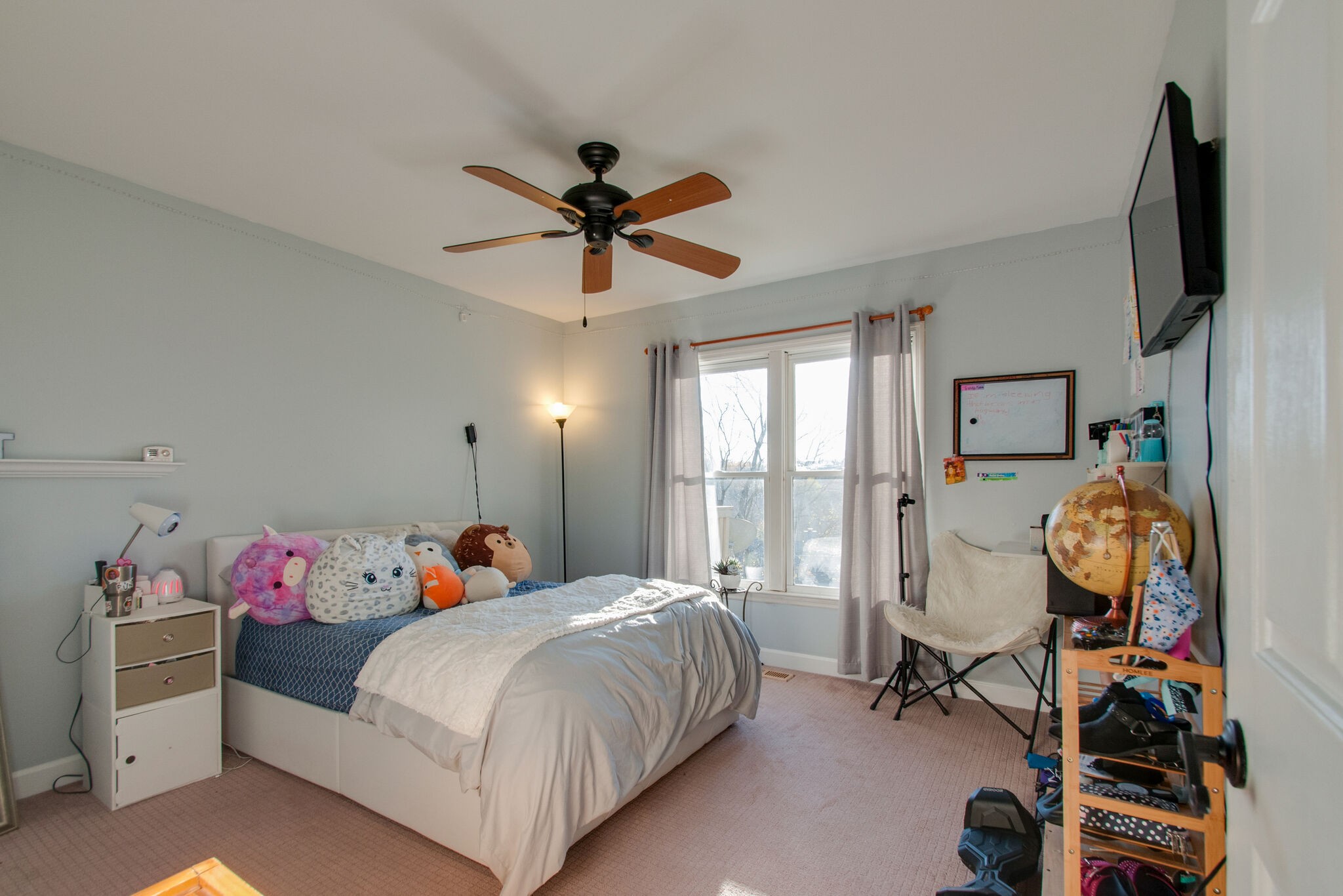 149 Morton Mill Circle Nashville, TN 37221 - Photo 22 of 27 a bedroom with a bed a window and a flat screen tv