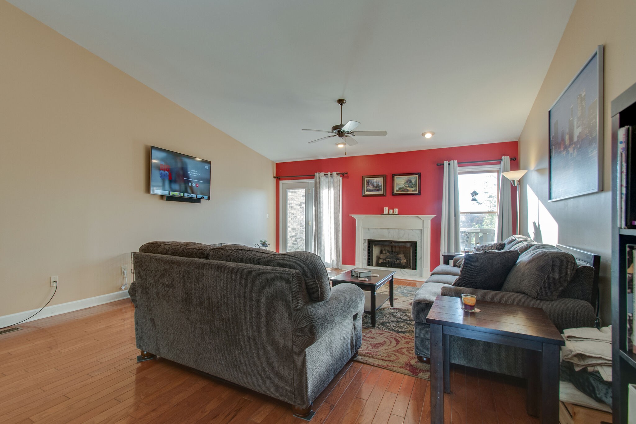 149 Morton Mill Circle Nashville, TN 37221 - Photo 7 of 27 a living room with furniture a fireplace and a flat screen tv