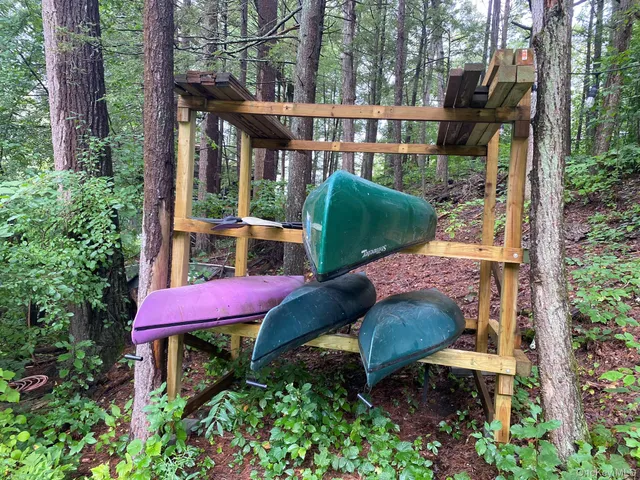 a view of a chair and table in the backyard