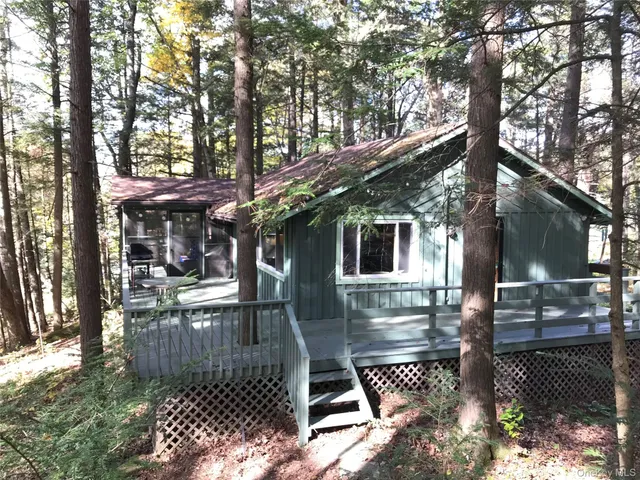 a front view of a house with yard porch and patio