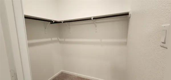 a white toilet sitting next to a white sink