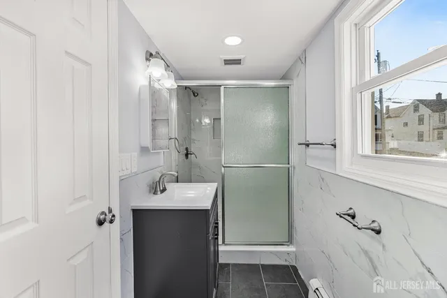 a bathroom with a sink and mirror