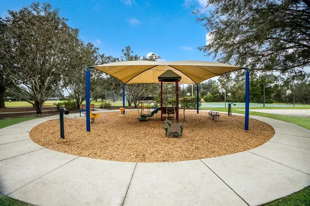 a view of an outdoor space and tennis court