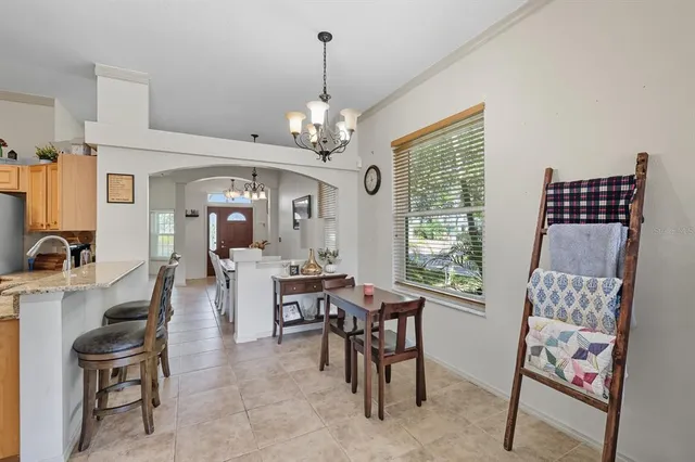 a view of a livingroom with furniture window and wooden floor