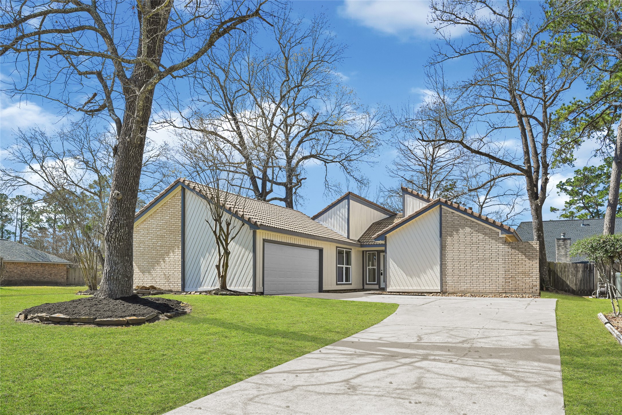 3203 Falling Brook Drive Houston, TX 77345 - Photo 1 of 27 a white house that has tree in front of it