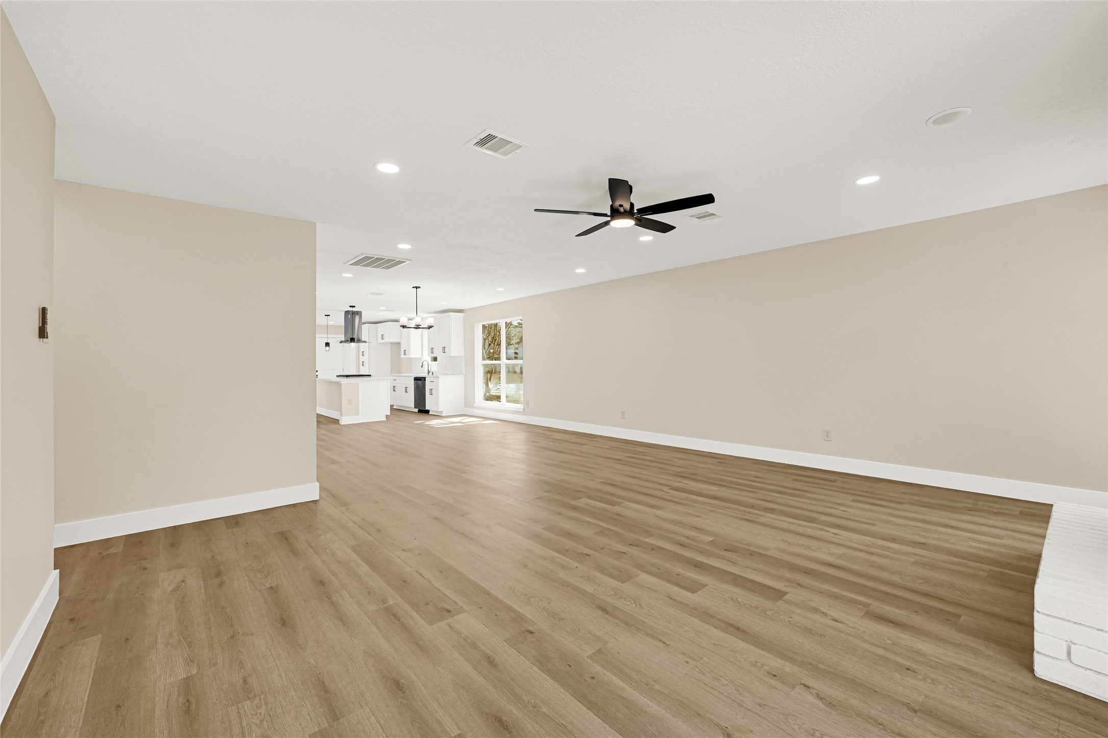 3203 Falling Brook Drive Houston, TX 77345 - Photo 14 of 27 a view of a livingroom with a kitchen