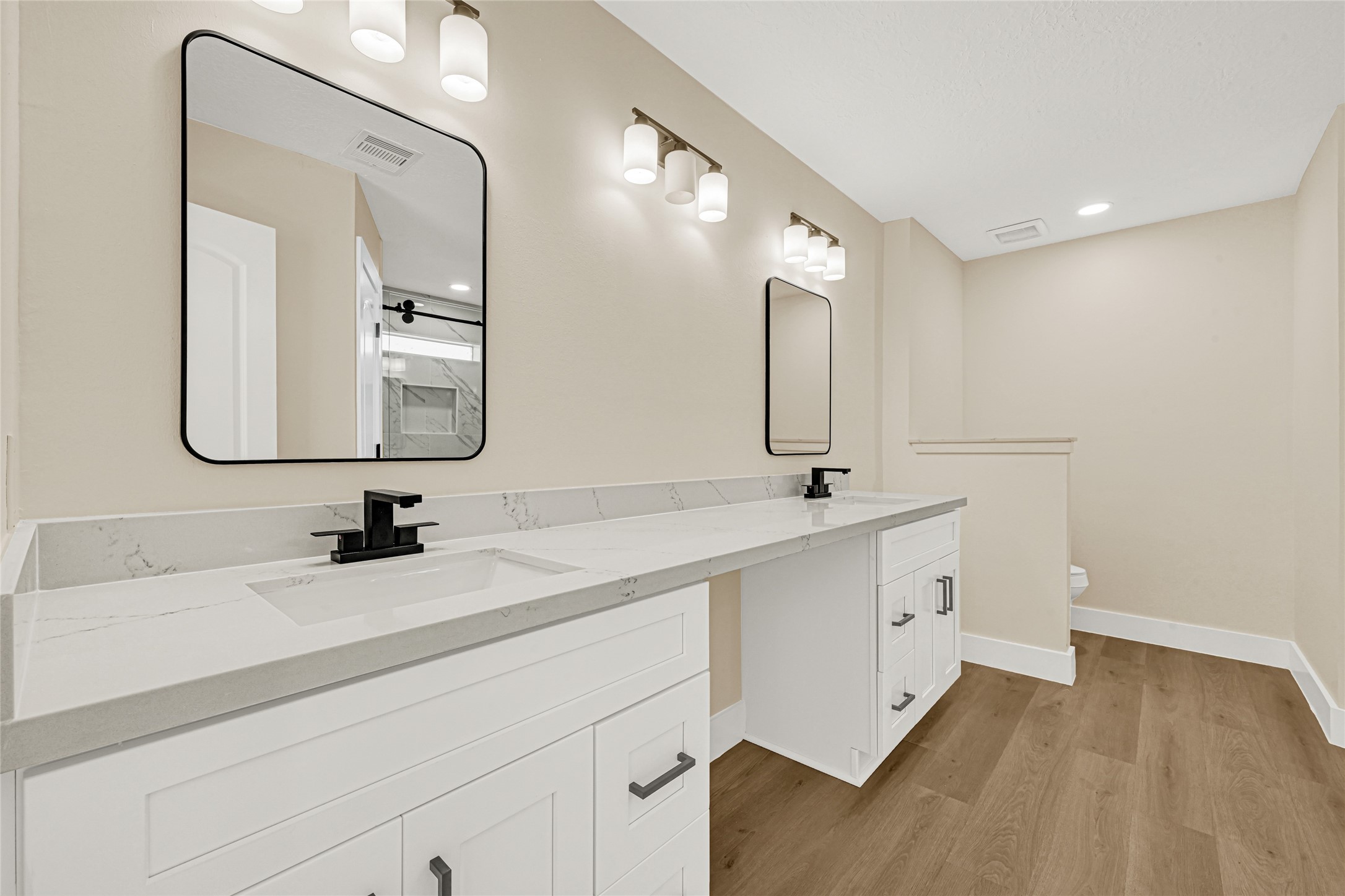 3203 Falling Brook Drive Houston, TX 77345 - Photo 18 of 27 a bathroom with a double vanity sink mirror and