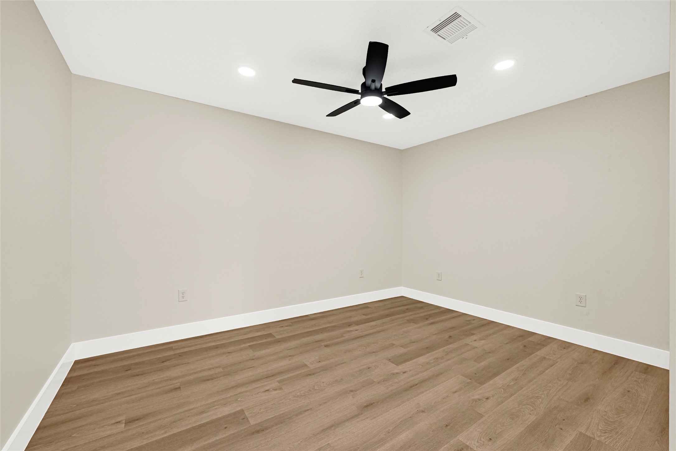 3203 Falling Brook Drive Houston, TX 77345 - Photo 24 of 27 a view of a big room with wooden floor