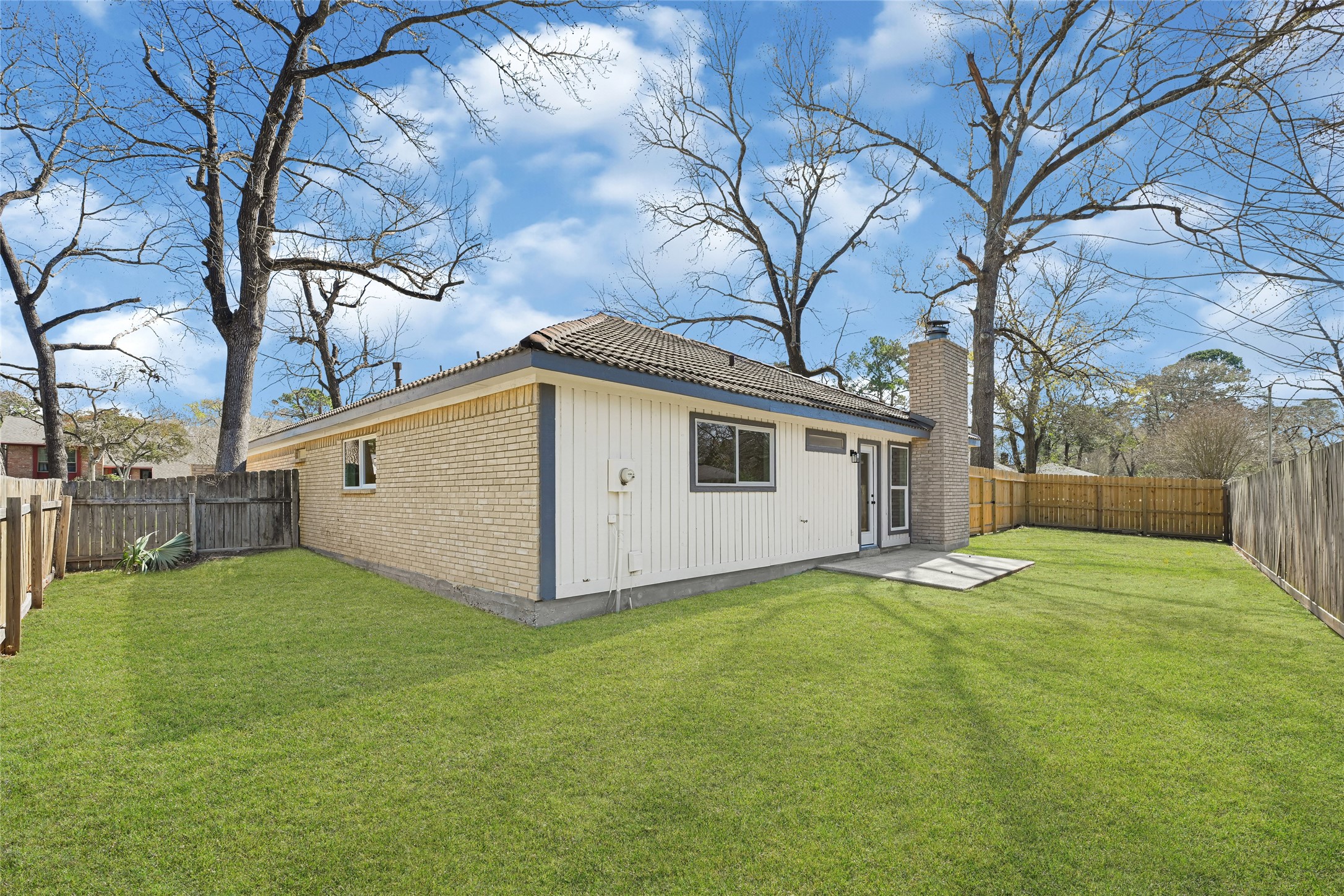 3203 Falling Brook Drive Houston, TX 77345 - Photo 26 of 27 a white house that has a big yard in front of it