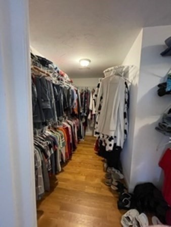 21 Gibbs Road Berlin, MA 01503 - Photo 13 of 29 a view of walk in closet with clothes and shoes