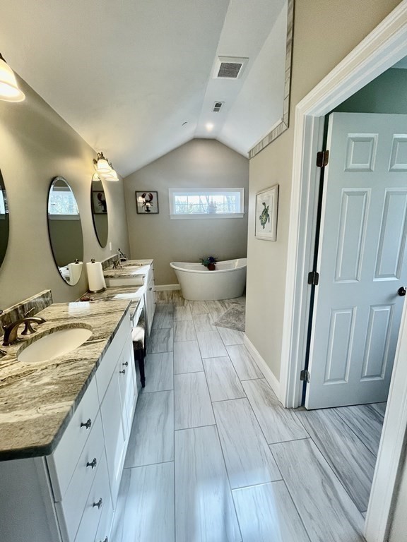 21 Gibbs Road Berlin, MA 01503 - Photo 14 of 29 a spacious bathroom with a double vanity sink and a mirror