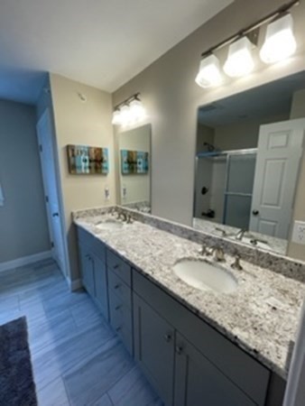 21 Gibbs Road Berlin, MA 01503 - Photo 19 of 29 a bathroom with a granite countertop sink and a large mirror