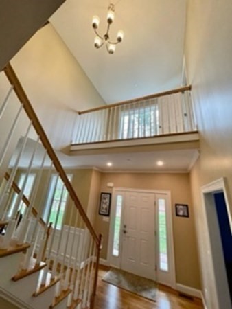 21 Gibbs Road Berlin, MA 01503 - Photo 4 of 29 a view of staircase with railing and a chandelier