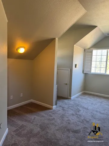 a kitchen with stainless steel appliances granite countertop a refrigerator a stove and a sink