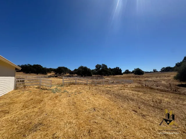 a view of a swimming pool with an outdoor space and seating area